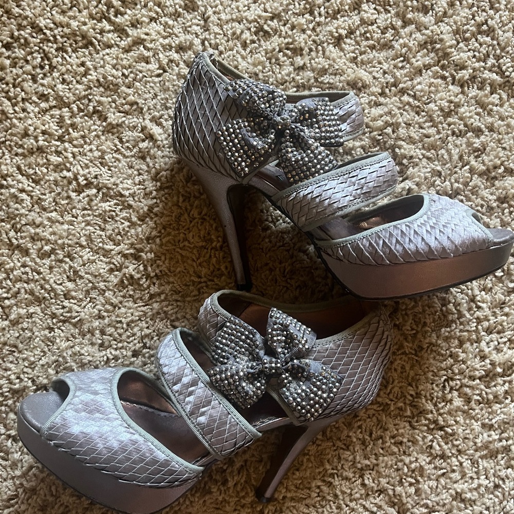 Silver heels with rhinestone bow